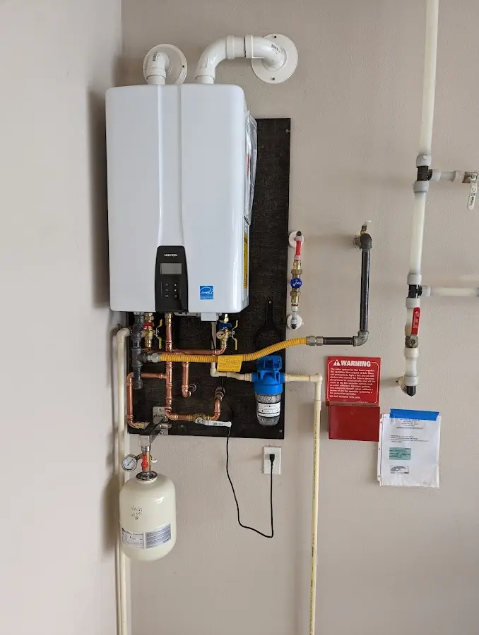 Professional plumber installing copper piping in a Mount Vernon home